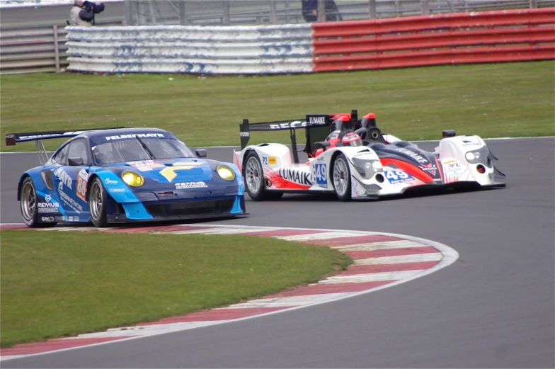 two race cars racing on the race track