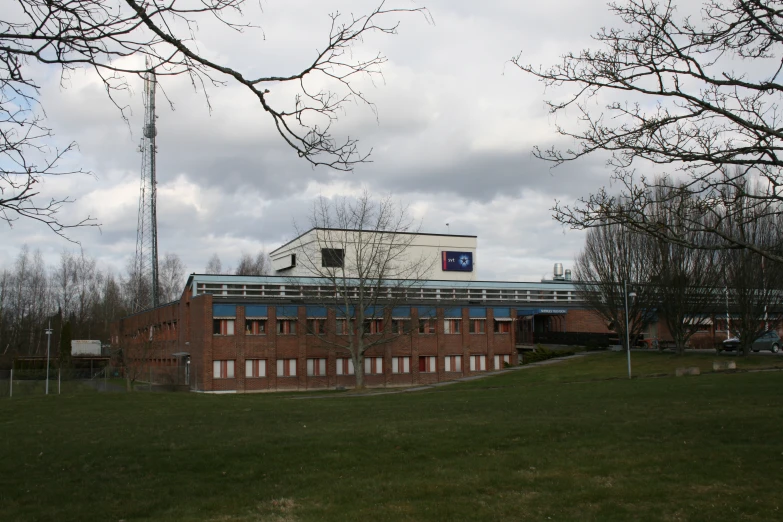 the building is red brick with blue and white trim