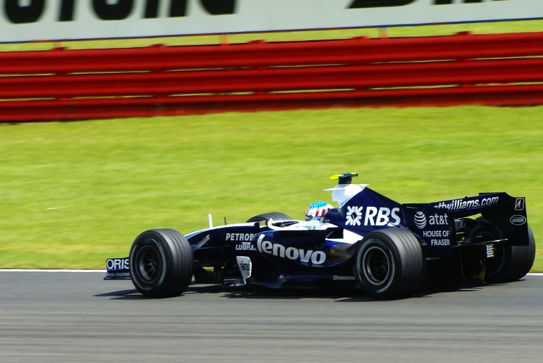 a blue racing car driving along the road