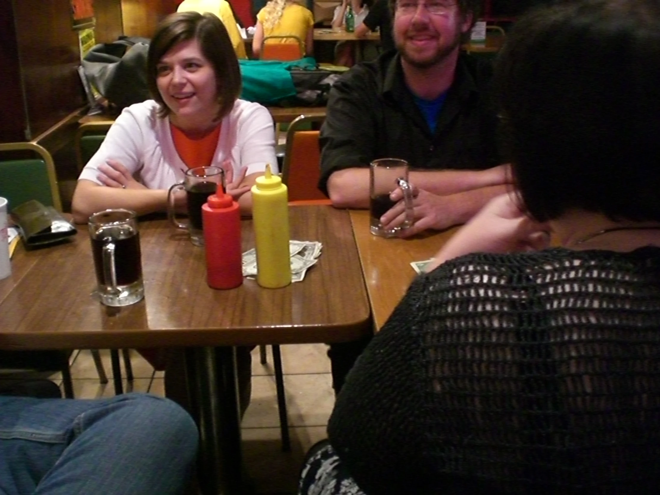 a group of people sitting at a table talking