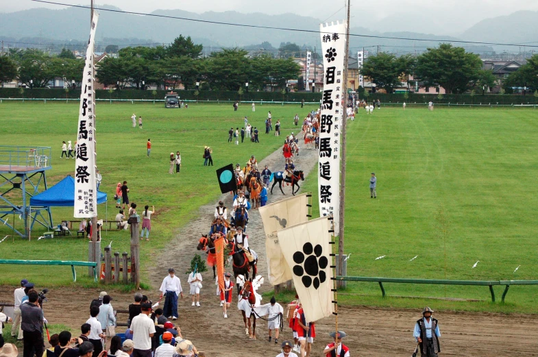 an overhead view shows horses in a race track