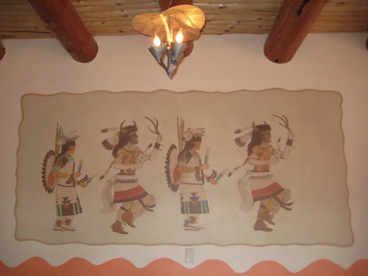 a decorative tapestry with four native american soldiers