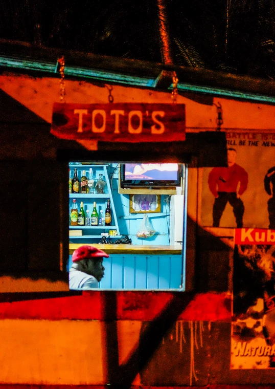 a large television mounted to the side of a building