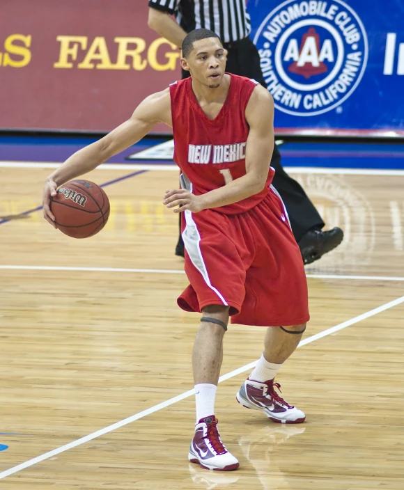 basketball player running with ball during a game