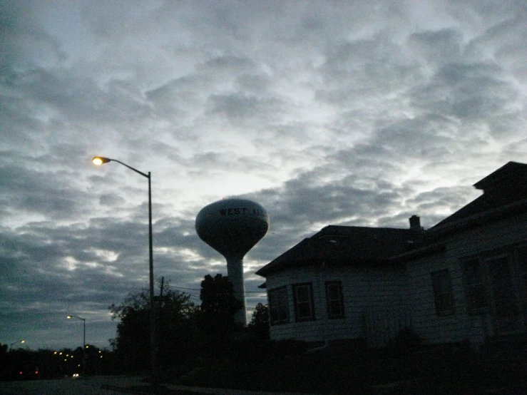 dark city buildings and clouds during twilight time