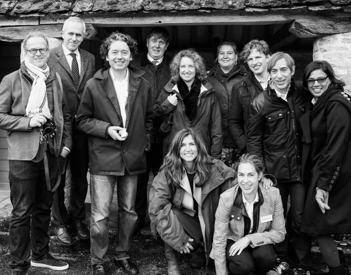 a group of people smiling and posing for the camera