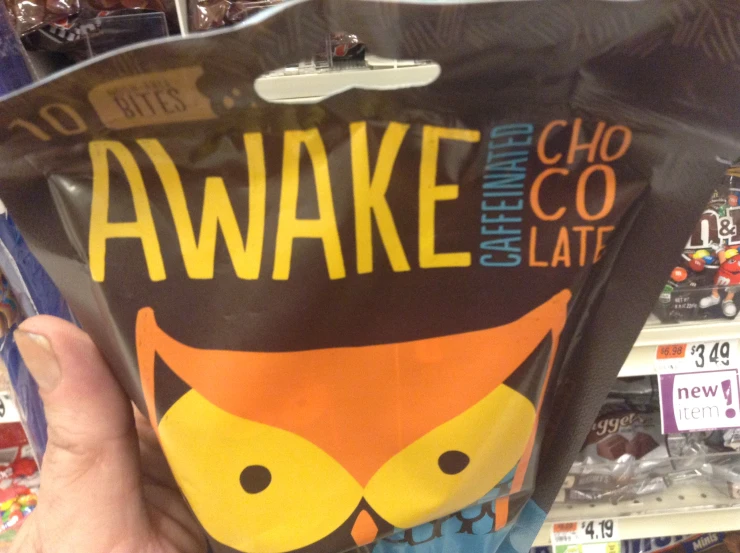 hand holding up a bag that says awake