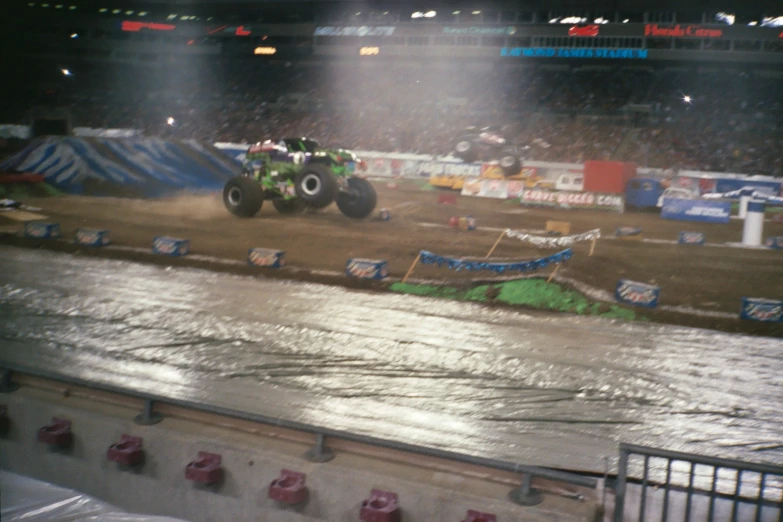 there is a monster truck going around a track