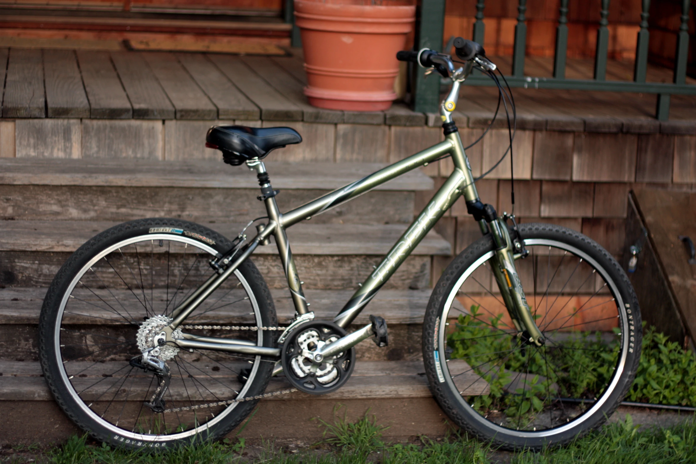 the bike is parked near a wooden step