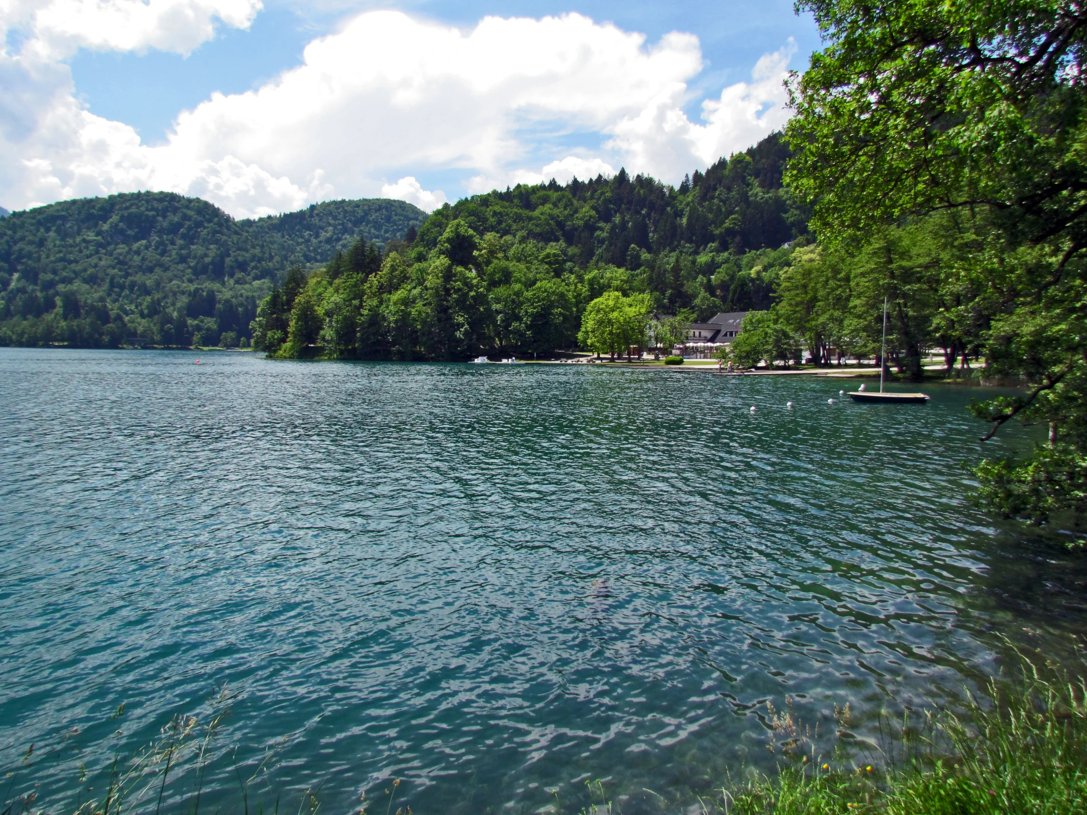 a mountain lake on a sunny day with blue water