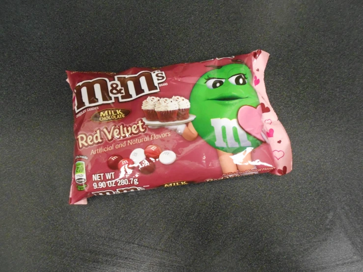 a snack bag with a picture of a red velvete covered in candy