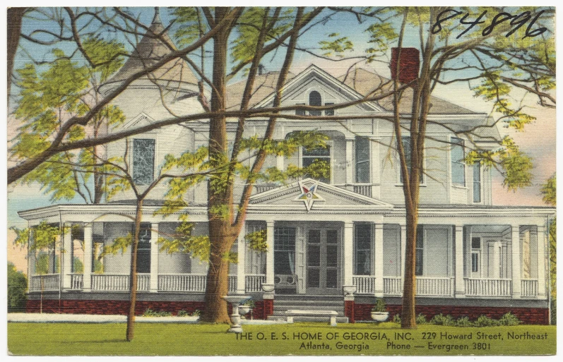 a large white house surrounded by trees