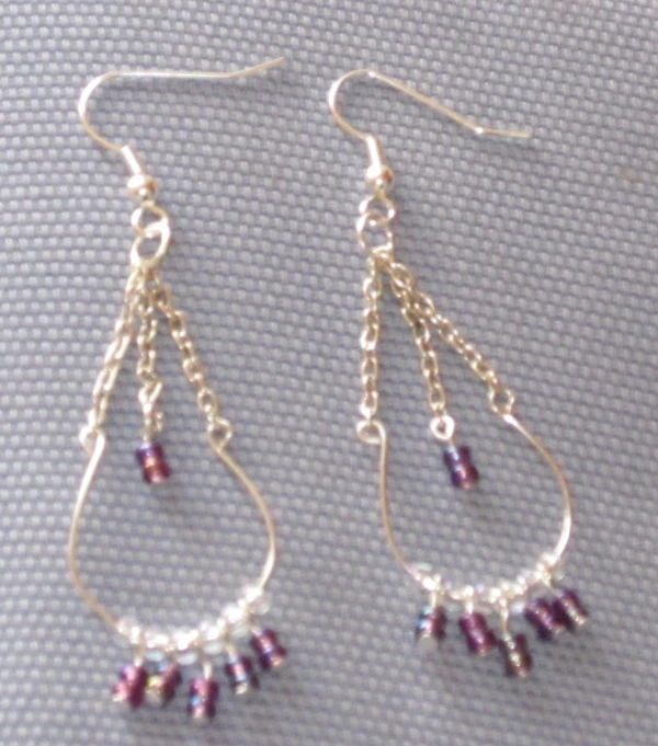 a pair of earrings is set on a table