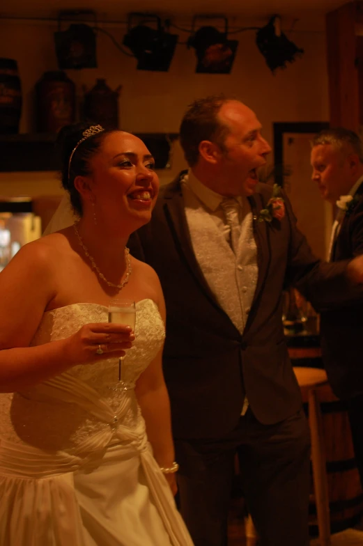 a man and a woman are smiling in a living room