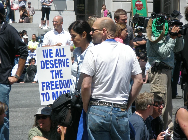 a large group of people marching in the street