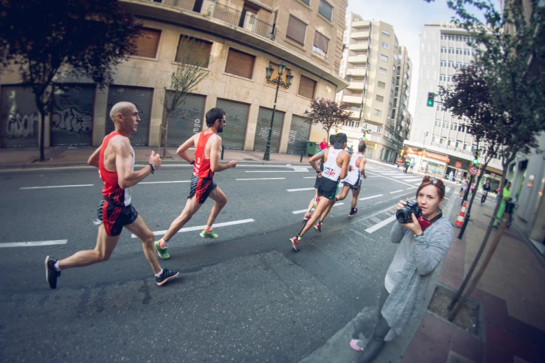 several people running down the street during an urban race