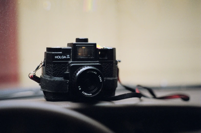 an old analog camera on a table