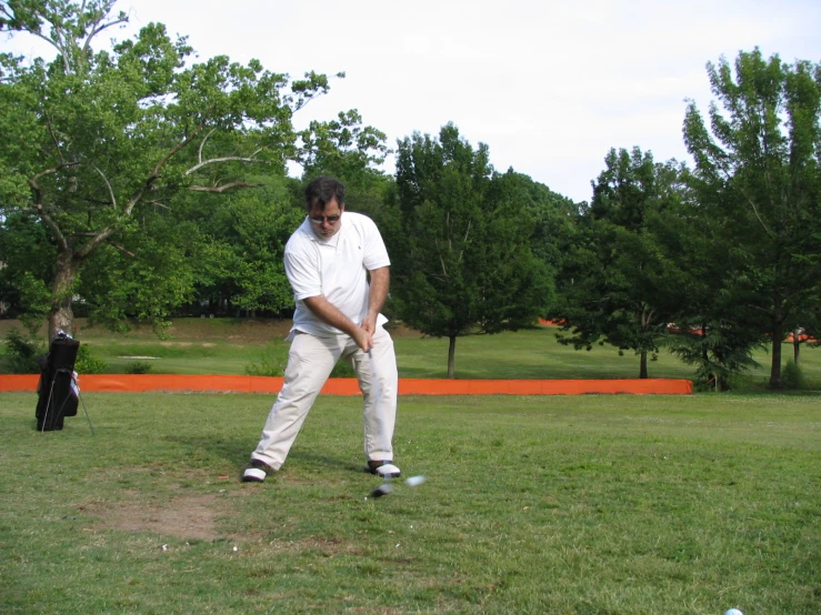 a man swinging his bat in a field