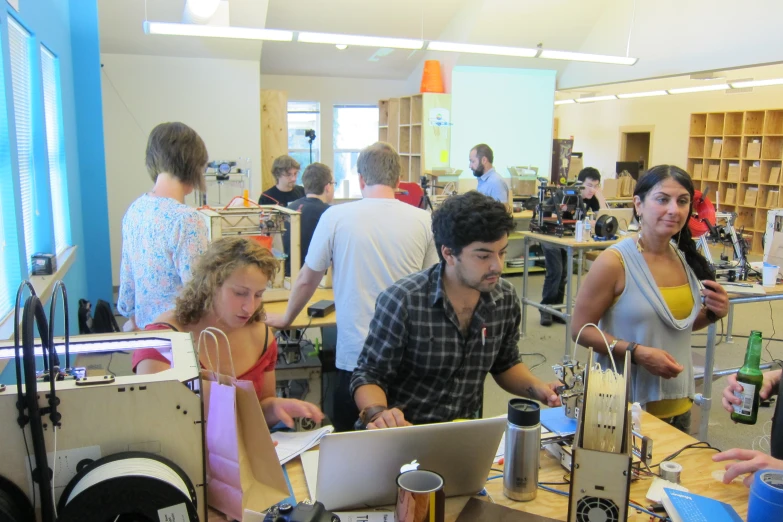 a group of people working together in an open building