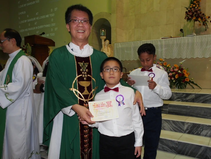 a  holding a plaque in front of an older man