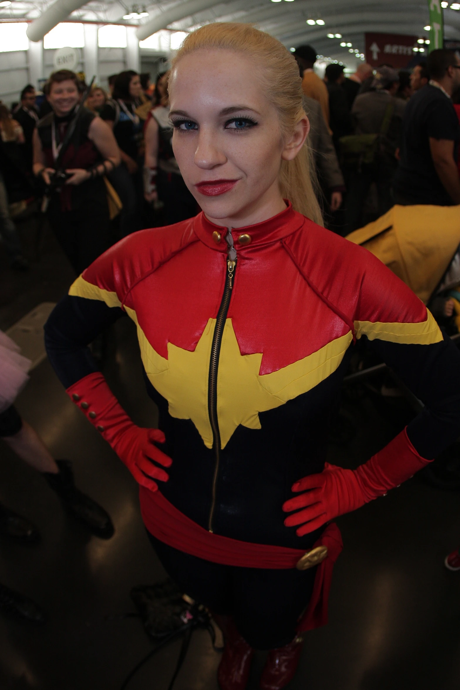 a woman in red and yellow cosplay costume