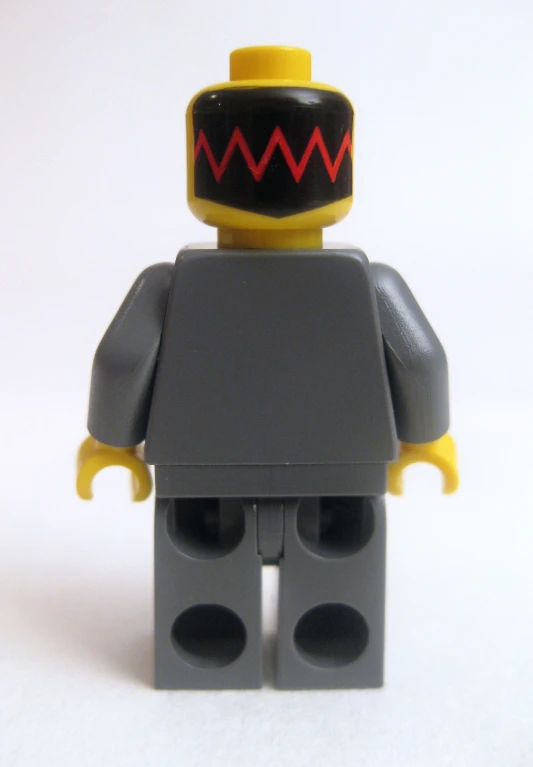 a close up of a lego figurine with an evil smirk