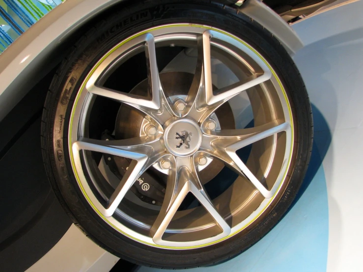 wheel of car parked in garage looking down