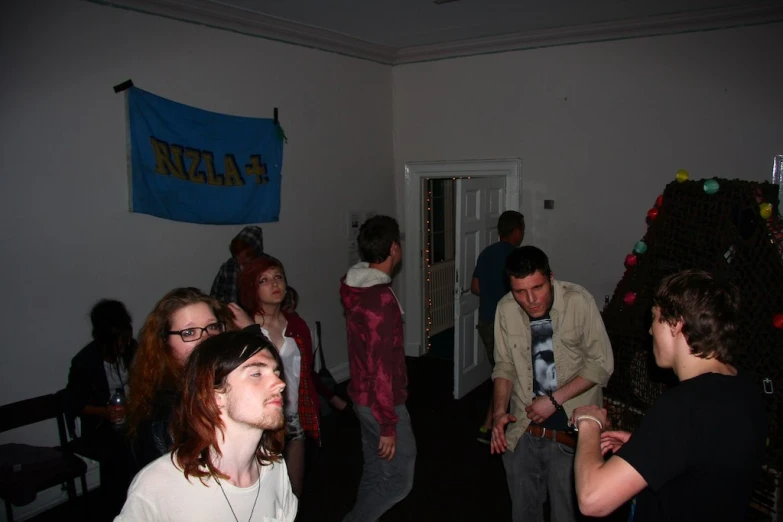 group of people gathered around in room on holiday
