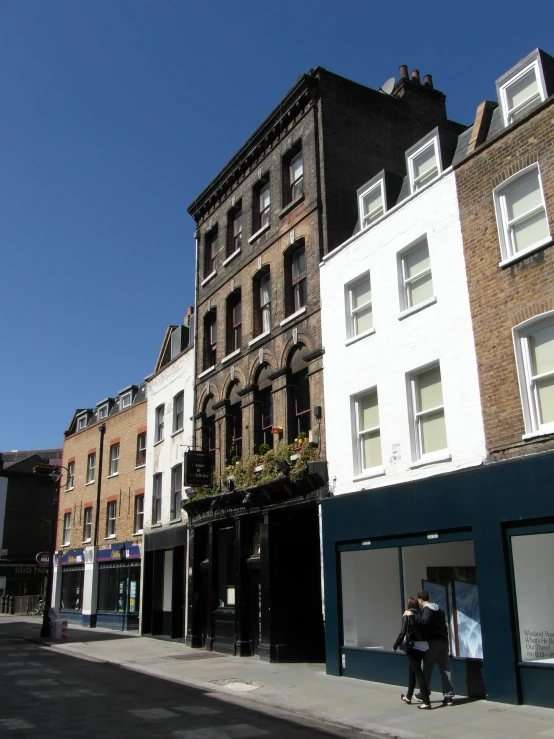 some tall buildings on the side of a street