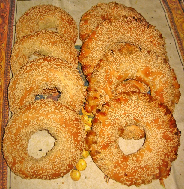 several bagels have holes in them on a table