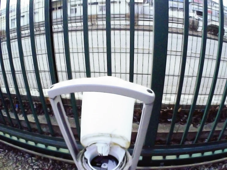 looking down at a security gate and an urinal