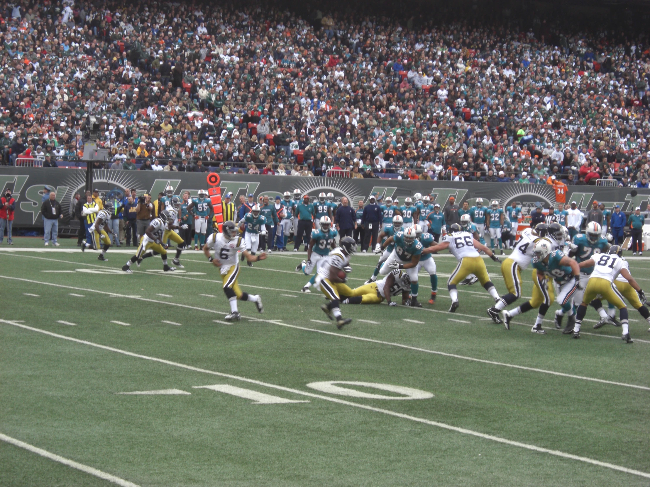 a football game with the opposing team on the field