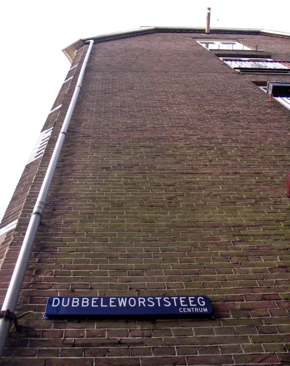 an old building with two streets signs on it