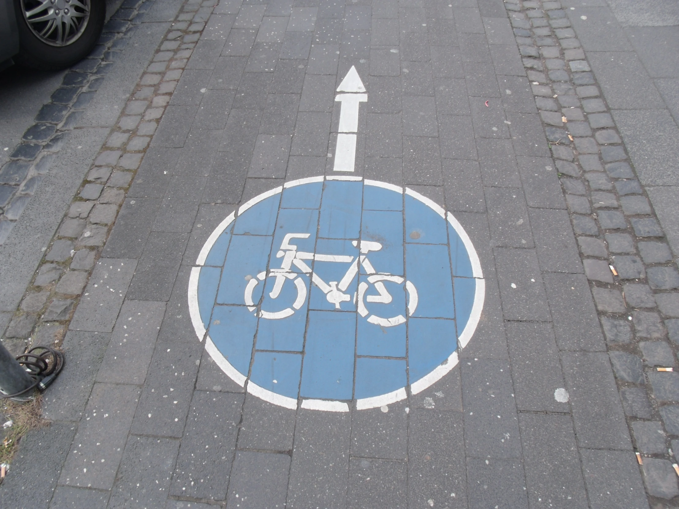 the bike parking spot is painted on the concrete