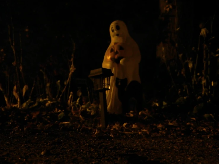 the ghostly ghost has been placed beside a bench