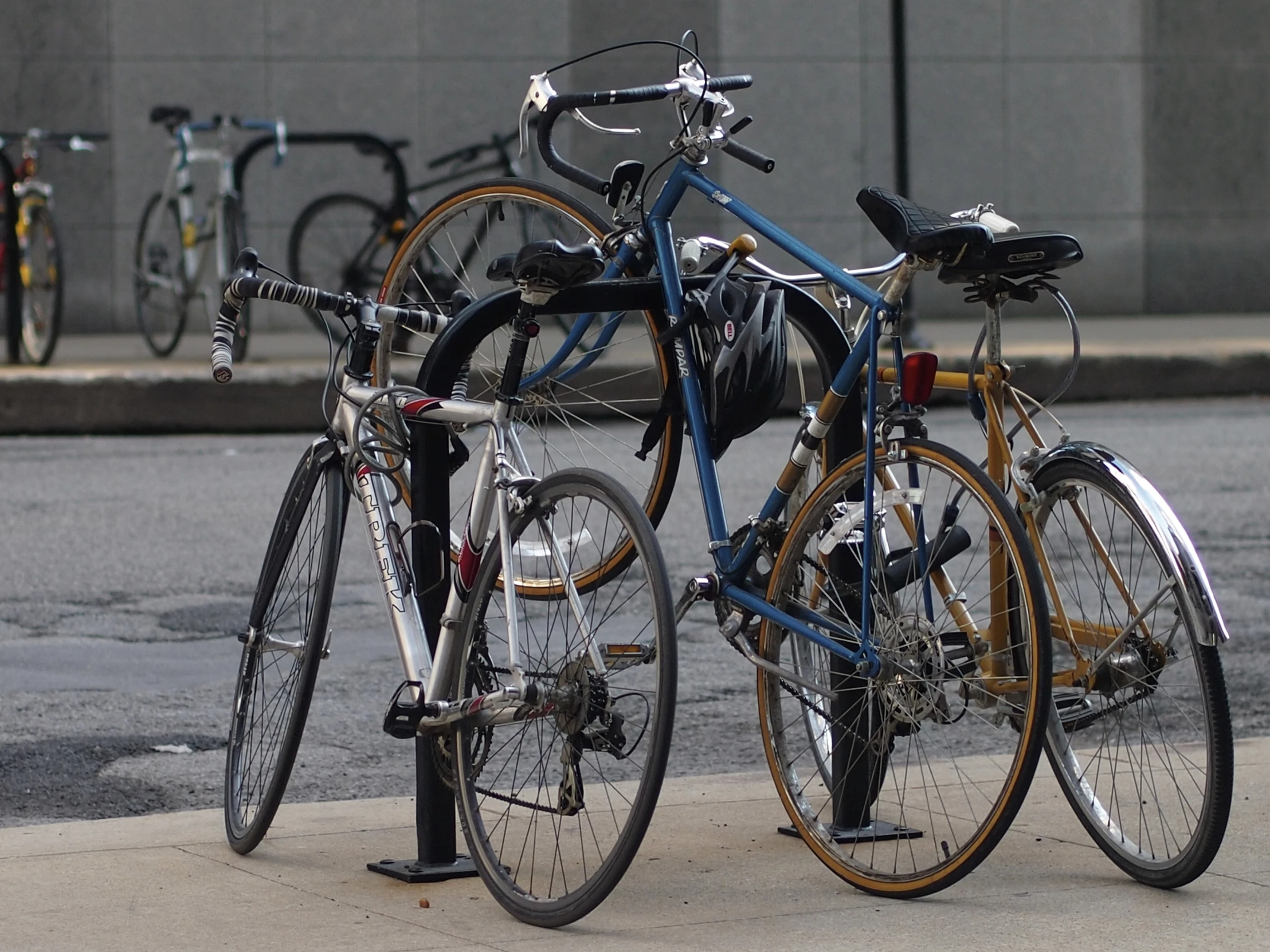 a bunch of bikes that are standing next to each other