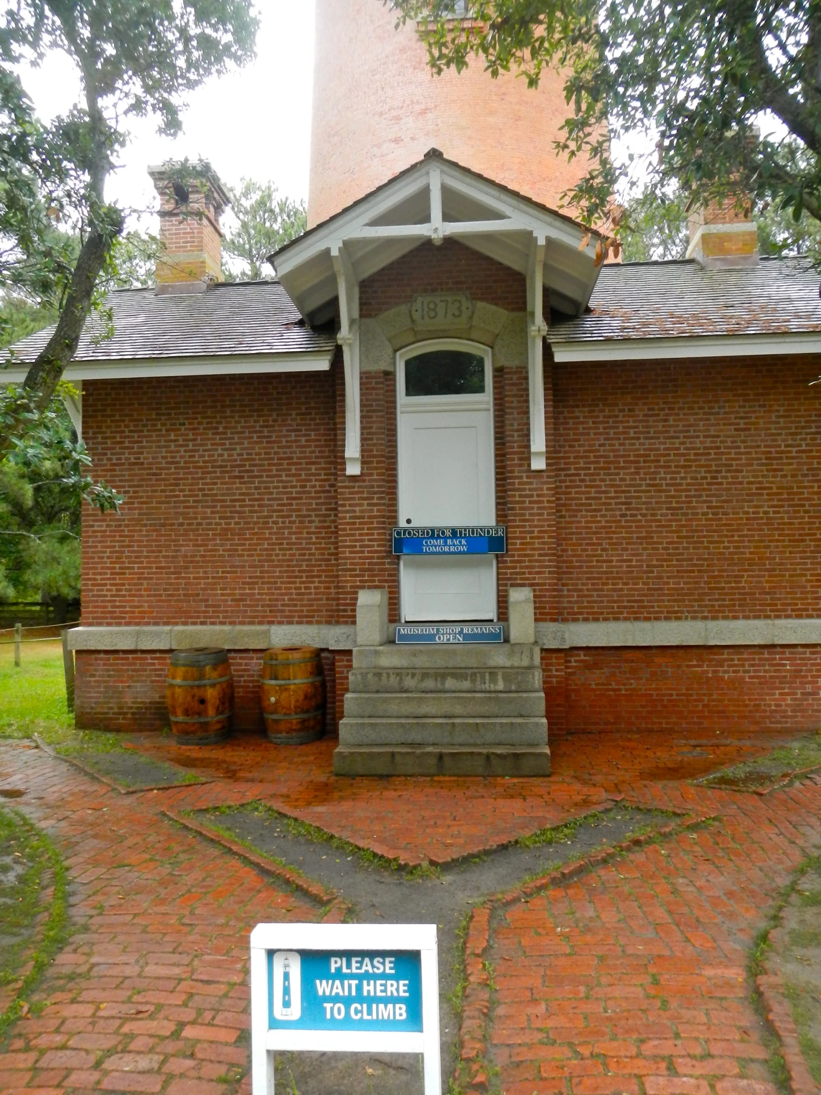 brick building and a sign with an inscription on it