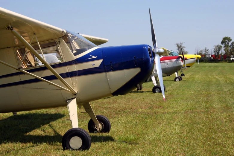 a couple of small planes parked next to each other