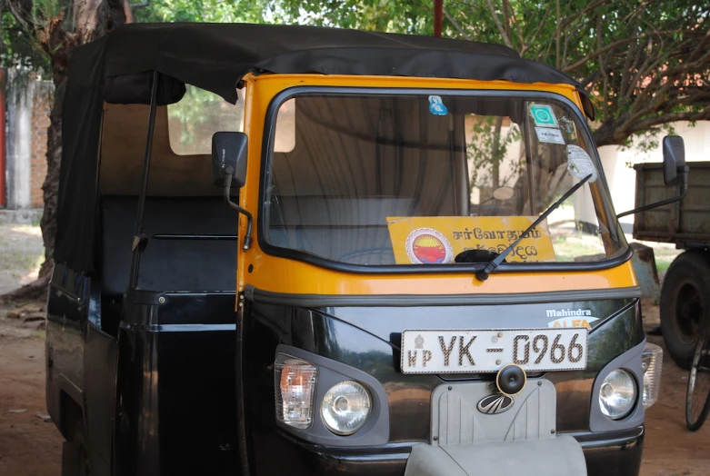 a taxi that has a black cover on it