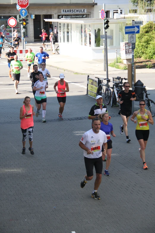 a group of runners run in a marathon