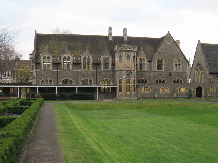 the very large and old style castle has many windows