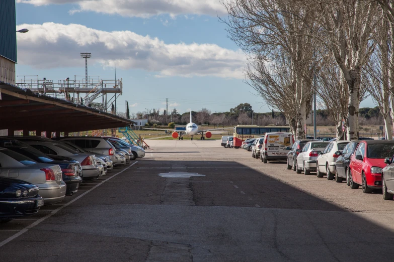 a lot filled with cars parked next to each other