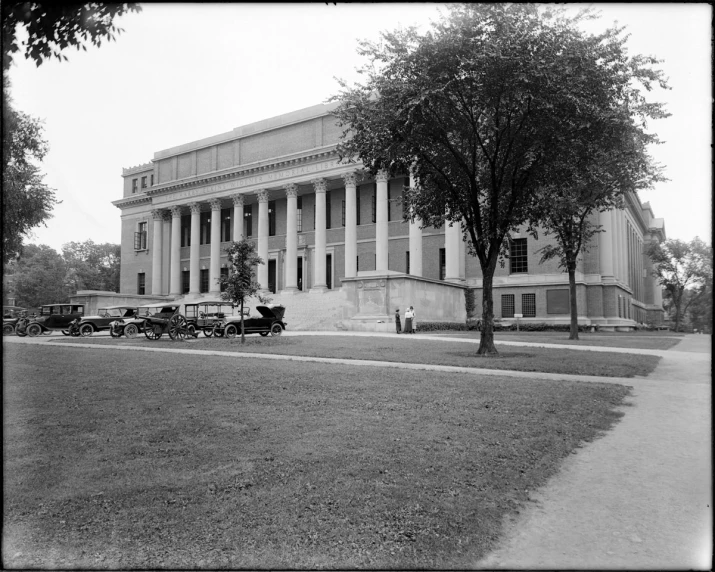 a man walking on the sidewalk in front of an old building