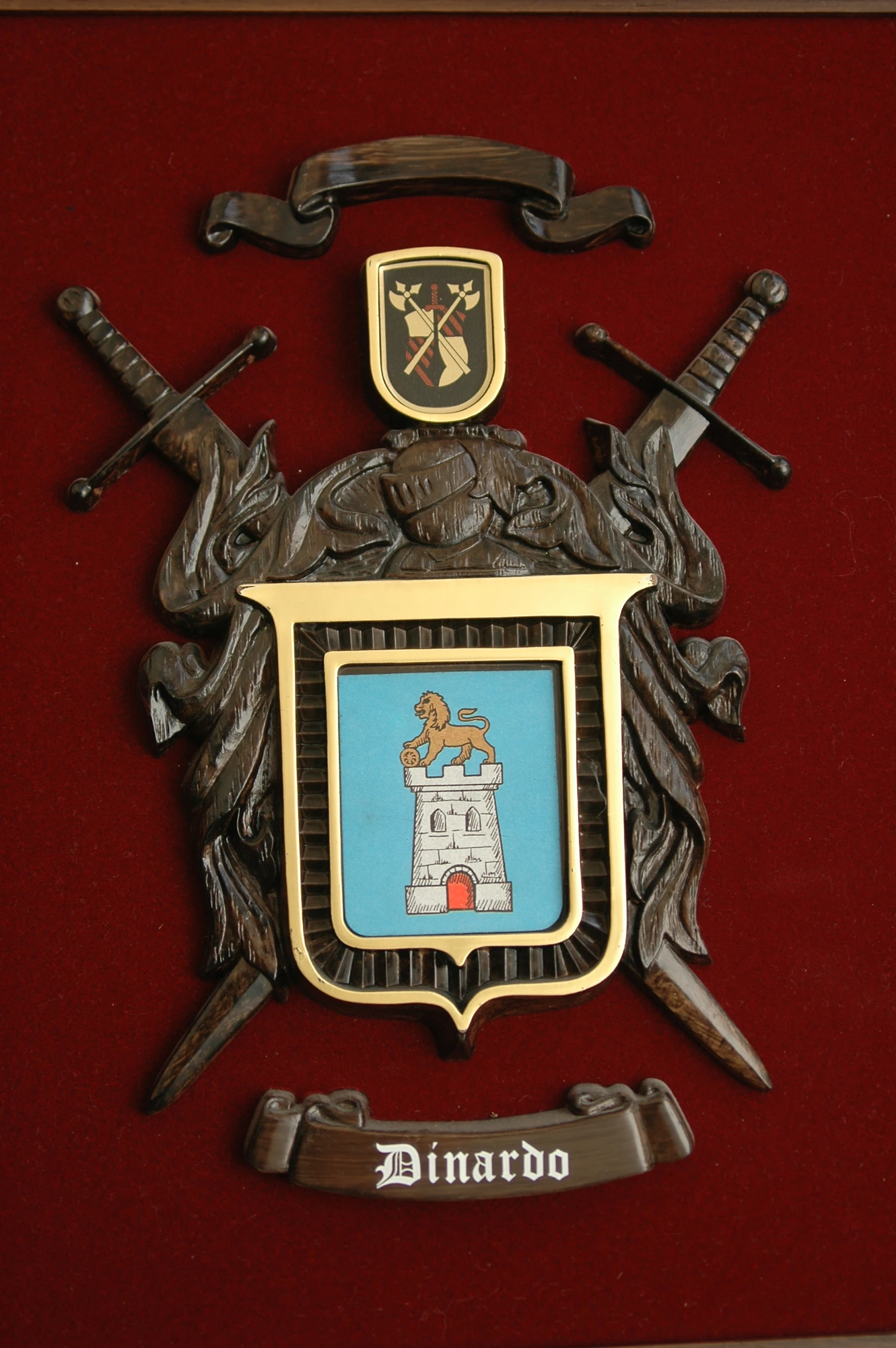 an iron clock with a wooden frame and a painted coat of arms