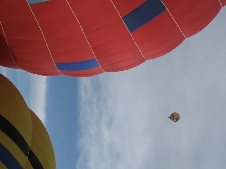 two large inflated balloons flying near each other