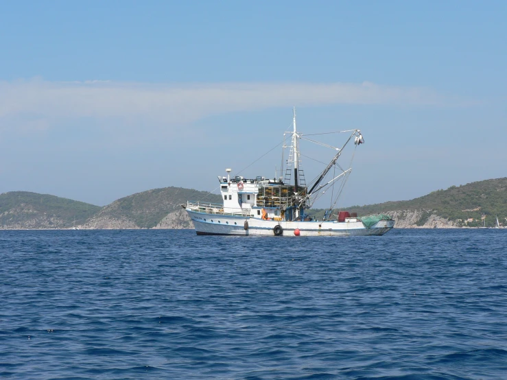 a large boat traveling on top of a body of water