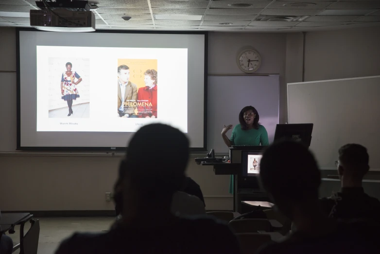 a woman teaching in front of a class