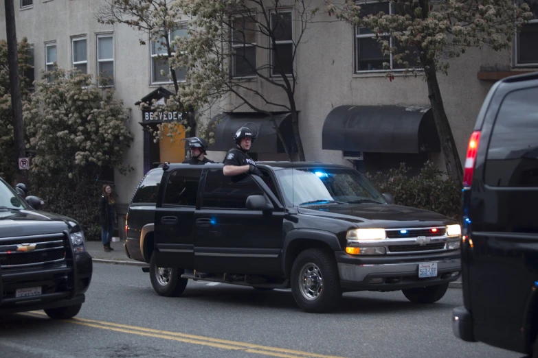 police officers in their trucks on the side of the street