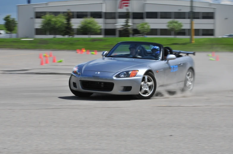 a car moving on a track with its wheels spinning