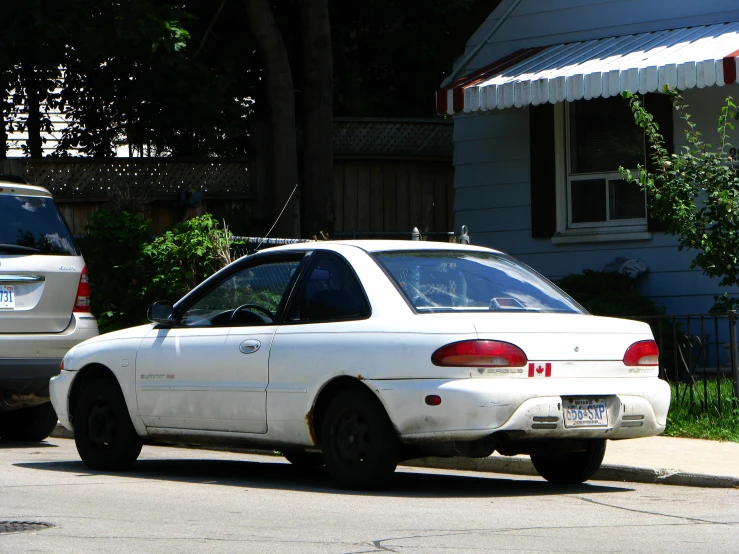 this is an image of a white car and silver car